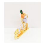 Image of Car dashboard statue of Lord Krishna playing a flute