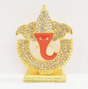Image showing a car dash board Idol of Lord Ganesha with meena work and stone work