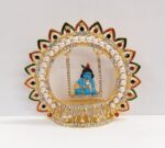 Image of baby Krishna - Laddu Gopal Idol on a Jhula - Swing.