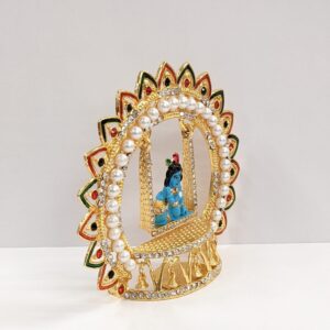 side view of krishna idol on a swing