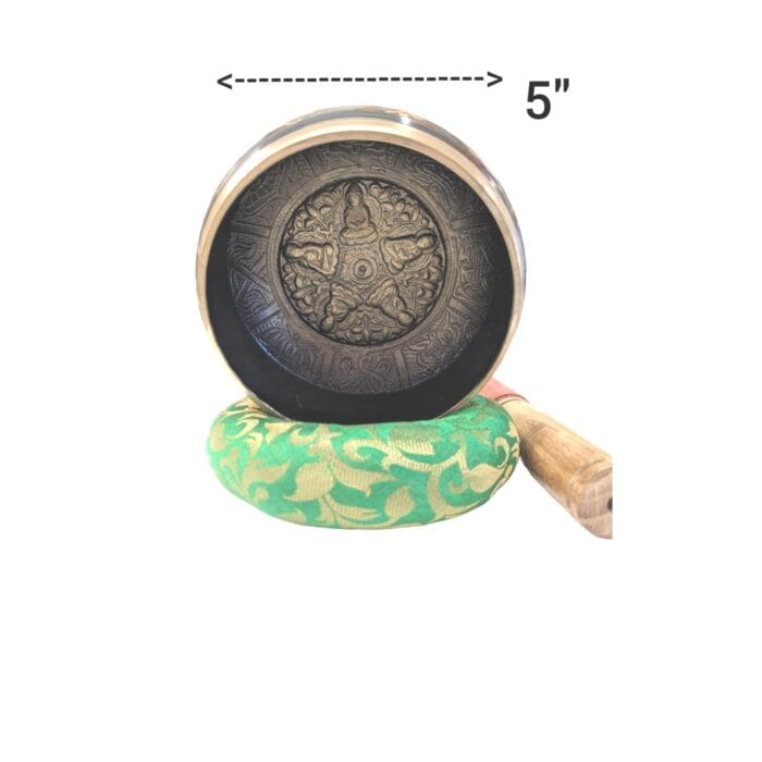 dimensions on Image of a 5 inches Tibetan Singing bowl with a wooden mallet placed on a Cushion Cover