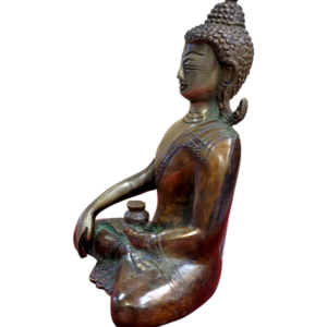 side view Image of a brass buddha in meditation pose