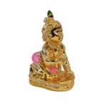 image of a gold plated laddu gopal krishna car dashboard idol