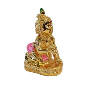 image of a gold plated laddu gopal krishna car dashboard idol