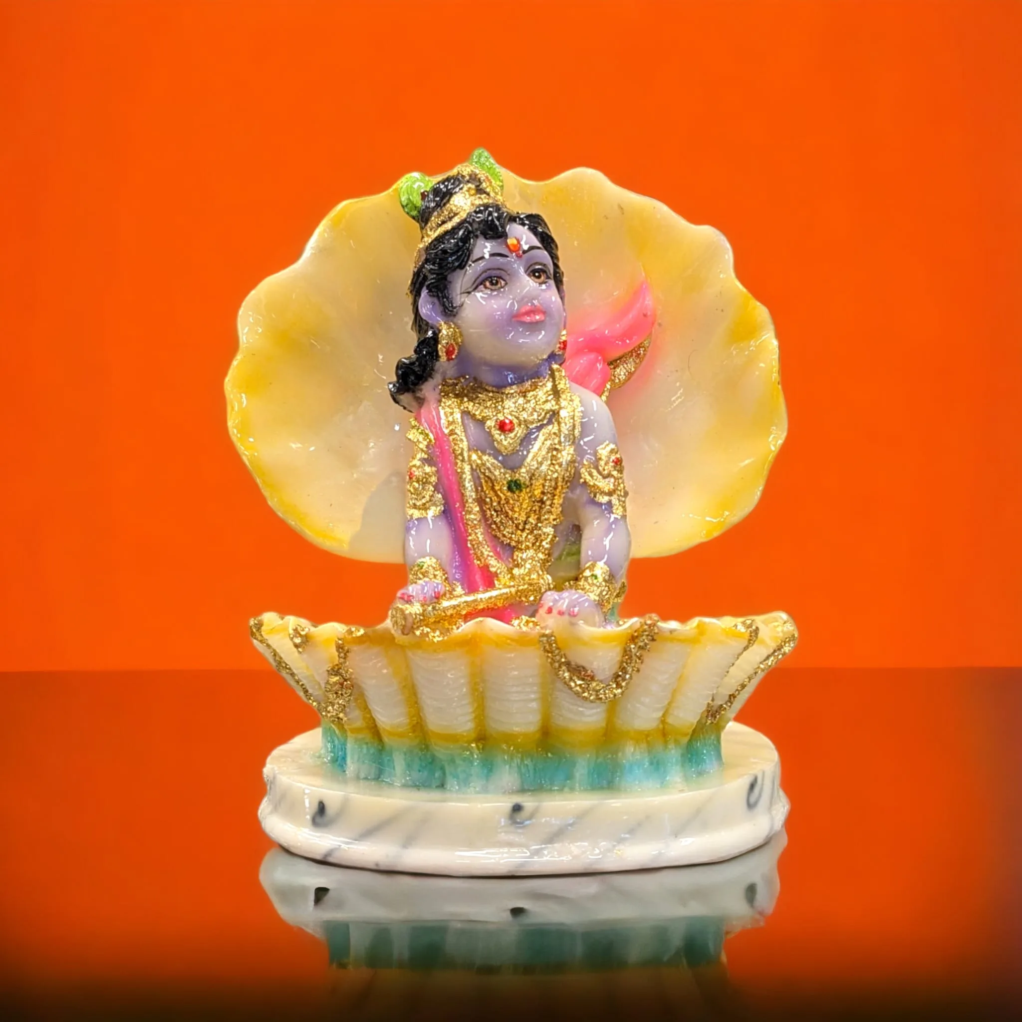 Image of Laddu gopal - baby krishna sitting inside a shell
