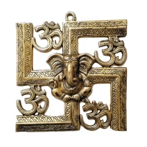 Image of a wall hanging of auspicious swastik with Ganesha and om brass hanging