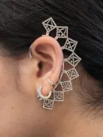 Silver oxidized brass ear cuffs | Close-up side view of a silver brass ear cuff being worn for a minimalist statement.