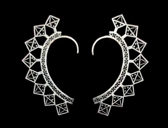 Close up of the brass ear cuffs with silver oxidized plating