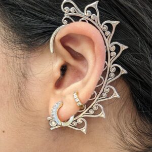 Silver oxidized brass ear cuffs | Close-up side view of a silver brass ear cuff being worn for a minimalist statement.
