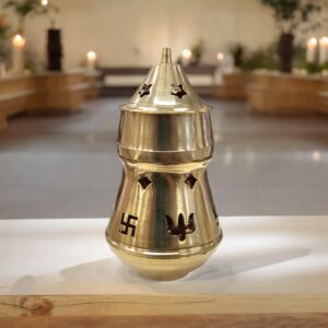 Brass Aroma Oil and Camphor Diffuser placed on a platform