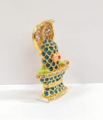 side view Image of Car dashboard Idol of Sheshnaag on shivling