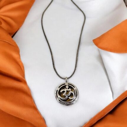 Tiger Eye stone encased in Om pendant necklace with oxidized silver chain