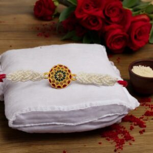 Elegant pearl and thread Rakhi for brother with gold accents | Send Rakhi to Canada