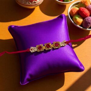 Dazzling Rakhi with gold plated cz stone