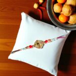 Send Rakhi to Canada : Elegant Murli Krishna Rakhi with quick shipping across USA and Canada
