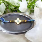 Stylish Flower Evil eye Rakhi - White