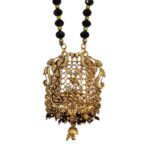 Close up of the golden Oxidized Pendant with Peacocks / Mayur a traditional Indian Jewelry