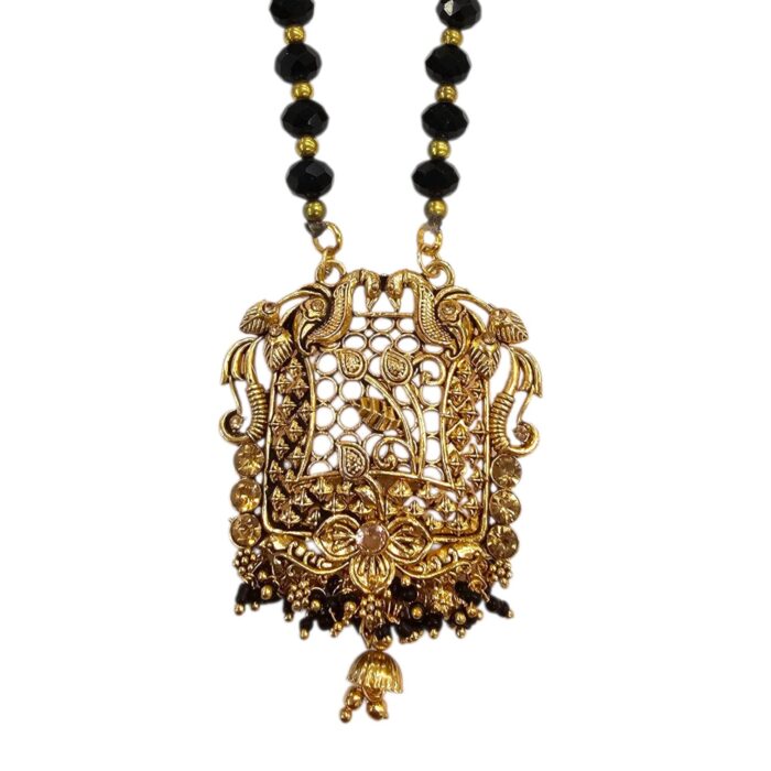 Close up of the golden Oxidized Pendant with Peacocks / Mayur a traditional Indian Jewelry