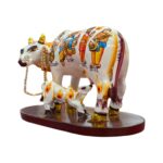 Side profile view of hand painted Kamdhenu Idol