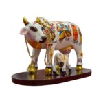 Side profile view of hand painted Kamdhenu Idol