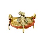 Close up of Large brass urli with elephants for Diwali Decor