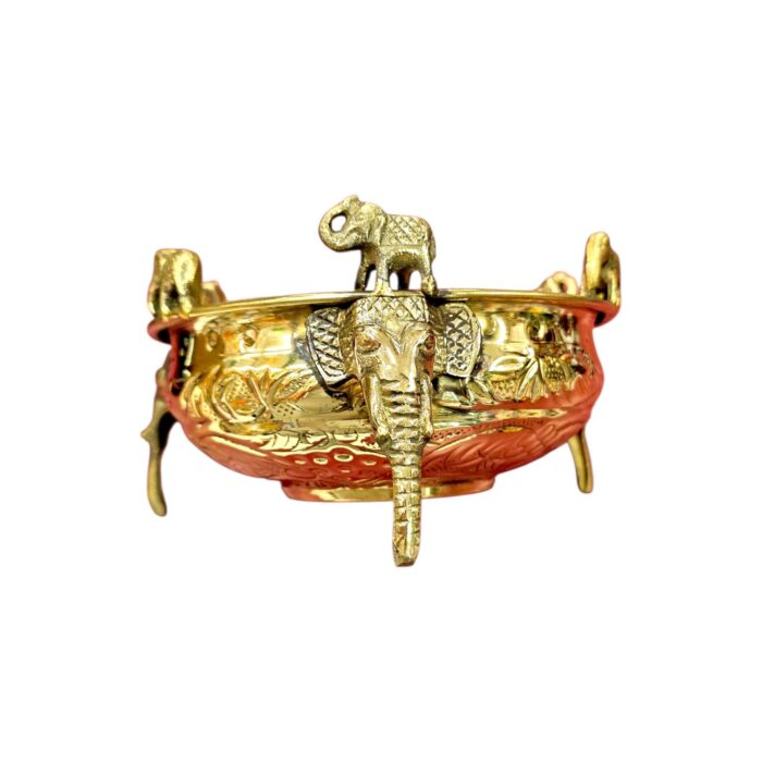 Close up of Large brass urli with elephants for Diwali Decor