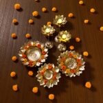 Top view of Urli bowl set with large urli bowls and candle stands