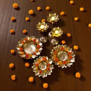 Top view of Urli bowl set with large urli bowls and candle stands