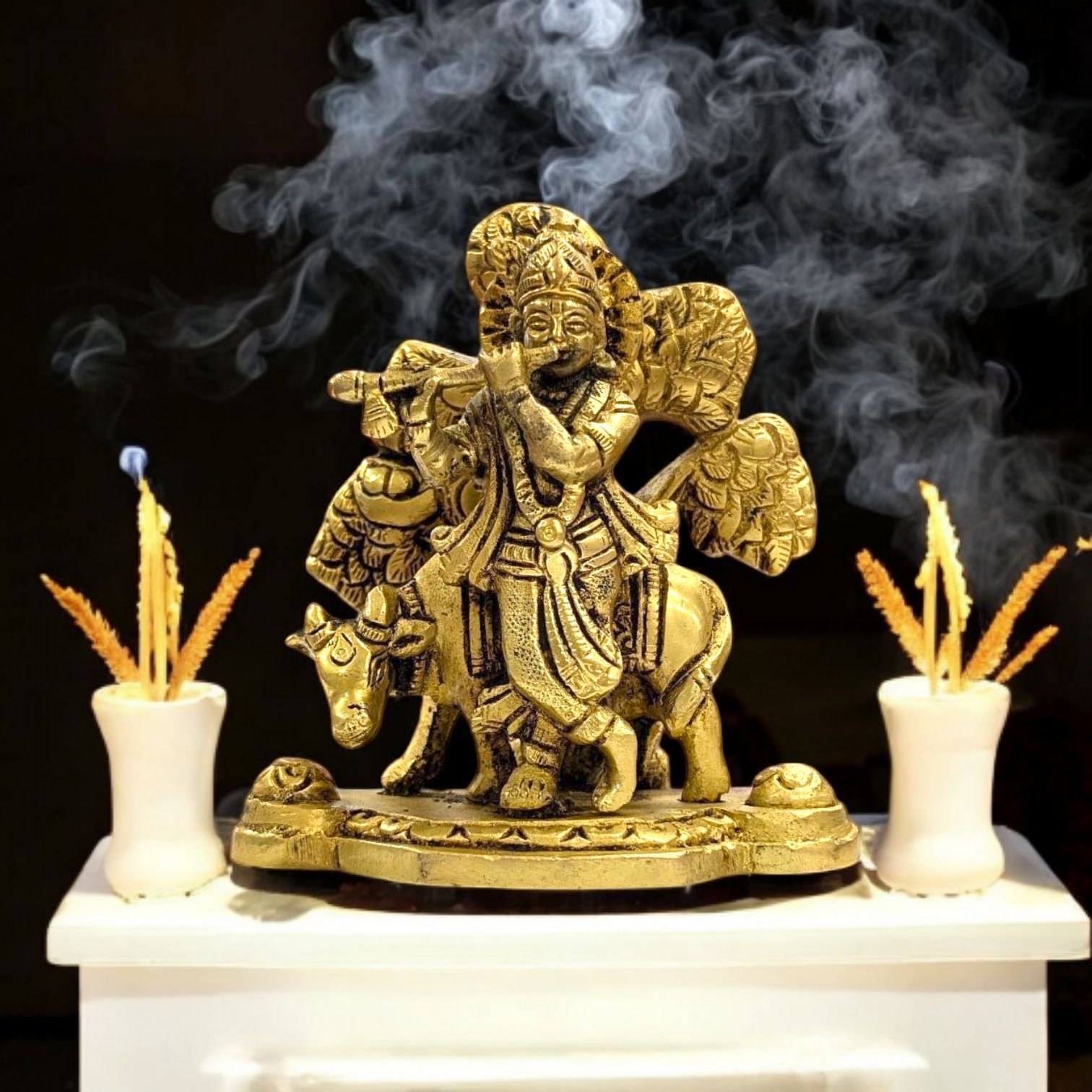Solid brass statue of Lord Krishna with a cow, handcrafted for worship and home decor.