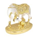 Side profile view of gold plated Kamdhenu cow