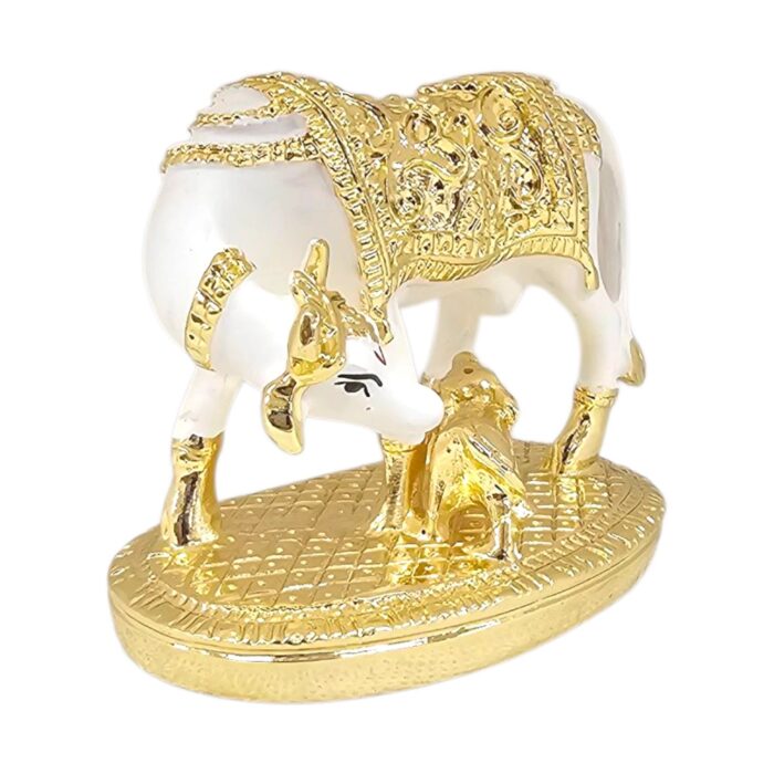 Side profile view of gold plated Kamdhenu cow