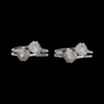 Close up of silver toe rings with zirconia stones