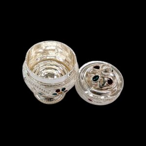 Top view of the silver kumkum container with lid open