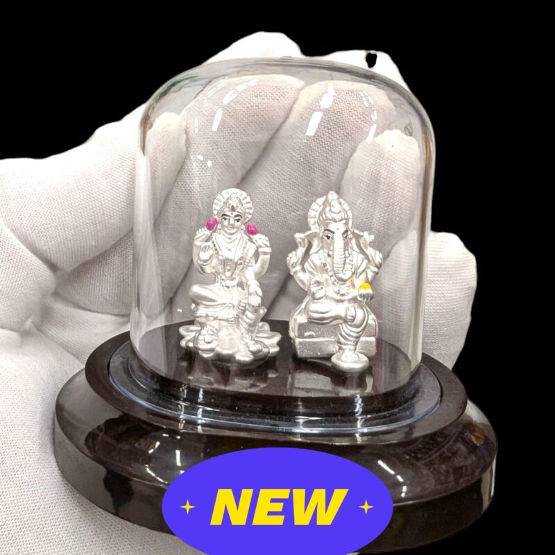 Close up of Pure silver Lakshmi Ganesha idol in dome