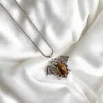 Handcrafted Bat pendant with natural Tiger Eye stone