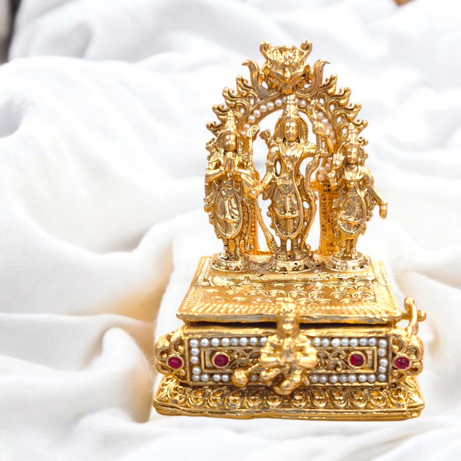 Ram Darbar kumkum box Ram Darbar Themed Kumkum Box in gold-plated copper with matte finish, showing Lord Ram, Sita, Lakshman, and Hanuman.