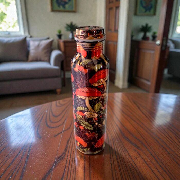 Artisan-made copper water bottle from India, shown on a wooden table.