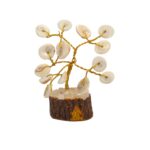 Close-up of a Gomti Chakra fossil stone on a delicate brass Tree of Life with wooden base.