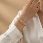 Elegant Gold-Tone Small Pearls & AD Stone Curved Bangle