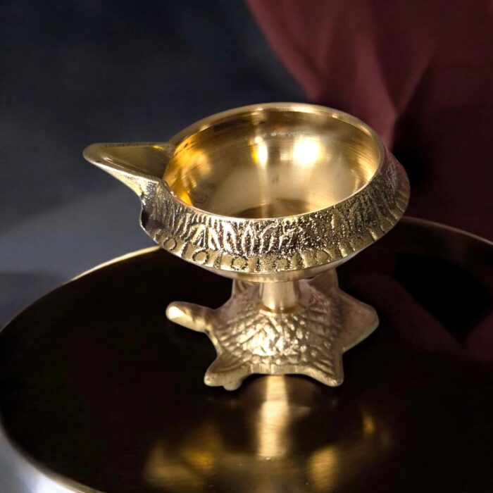 Brass kuber diya with a tortoise base