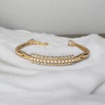 Elegant Gold-Tone Small Pearls & AD Stone Curved Bangle - Image 3