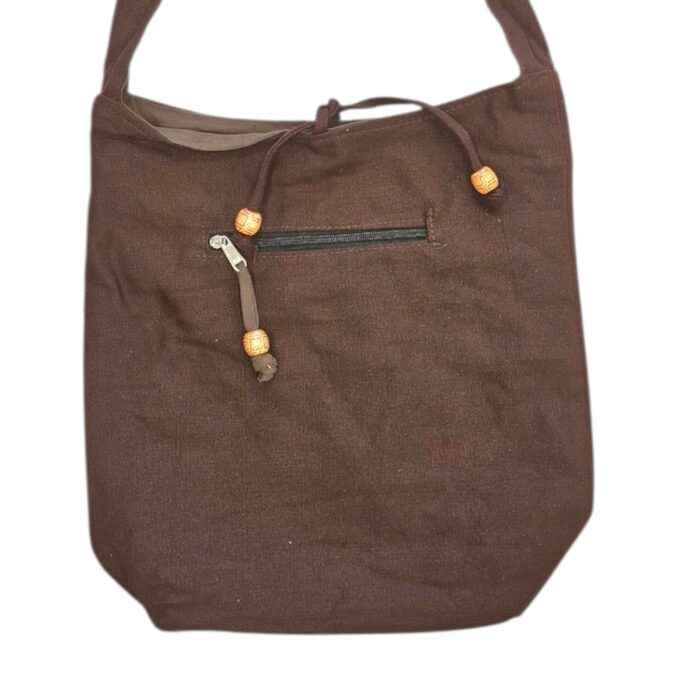 Close up of the cotton crossbody bag | Practical everyday use with zipper on the top and on the outside pocket.