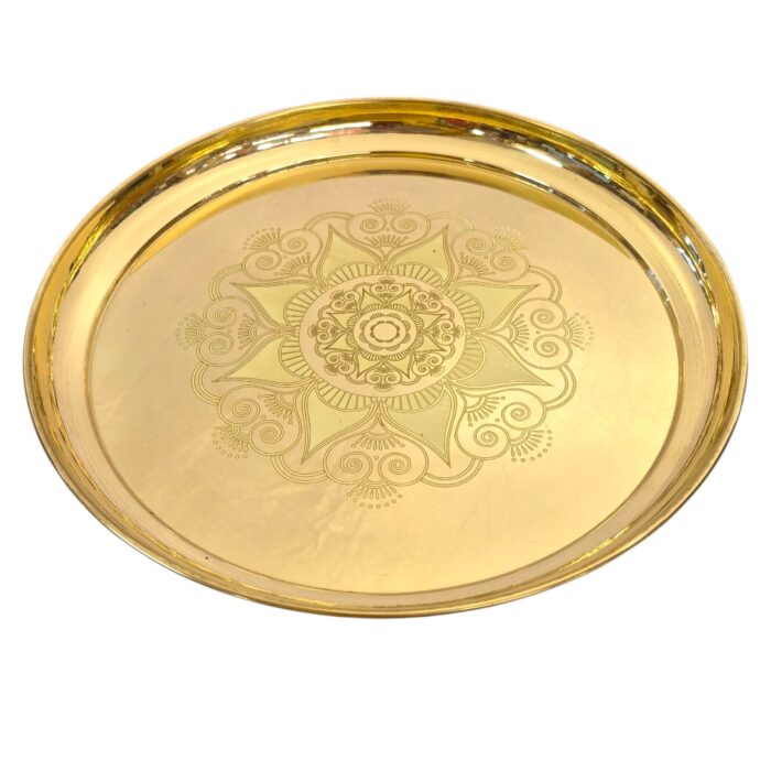 Close up of large brass plate for pooja and home decor