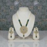 Swarnika Noor Rani Haar Set with green crystals and white pot beads