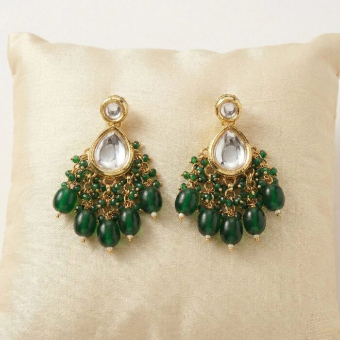 Close up of Kundan earrings with emerald Green