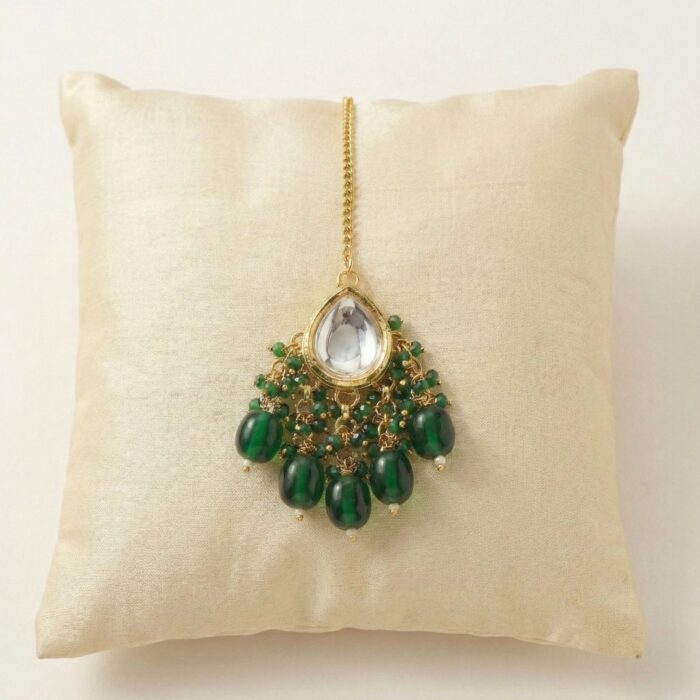 Close up of Kundan Tikka with emerald Green