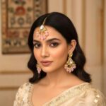 Maang Tikka close up showing Kundan stone work with matching earrings