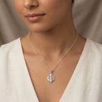 Model wearing a Pure silver Khanda pendant