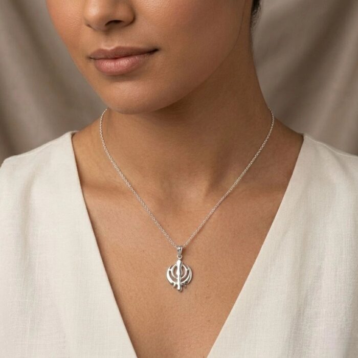 Model wearing a Pure silver Khanda pendant