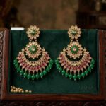 Match your attire with these Kundan Earrings with green beads and Rani highlights